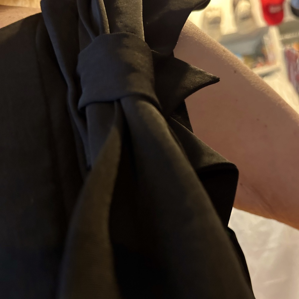 K Studio black dress size 14. Hangs nicely bow on shoulder ruffle down side